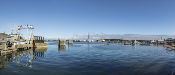 sailing ships anchor in the harbor of Tisbury