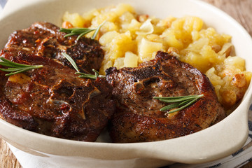 Steak of lamb with rosemary and apple chutney close-up. horizontal