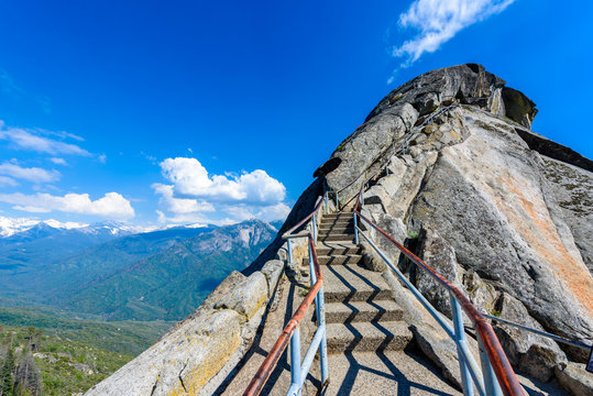 Hike on Moro Rock Staircase toward mountain top, granite dome rock formation in Sequoia National Park, Sierra Nevada mountains, California, USA