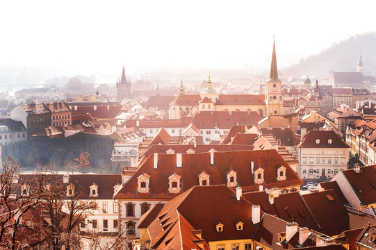 Prague roofs and buildings panoramic view in a foggy day, Czech Republic