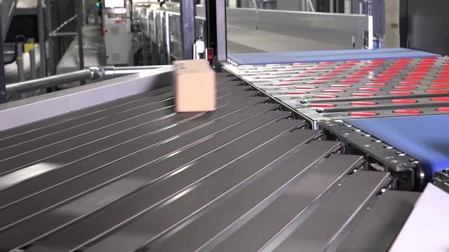 Parcels and foil bags on conveyors - time lapse