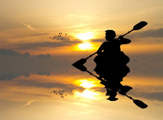 man with a kayak at sunset - obrazy, fototapety, plakaty