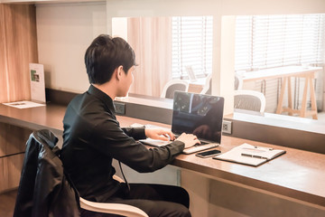 businessman working with labtop or notebook and calculator on the table at office.