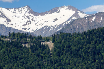 snow-capped mountain peaks against the blue sky