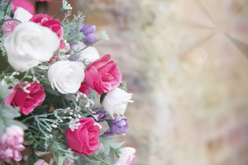 Artificial flowers in tones and soft light blur.
