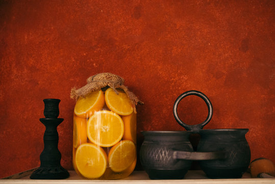 jur with preserved oranges on the shelf