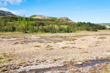 Naklejka premium stream in Haukadalur hot spring valley in Iceland