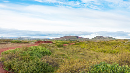 landscape with red volcanic soil in Iceland