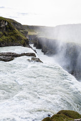 Gullfoss waterfall falls at the bottom of canyon