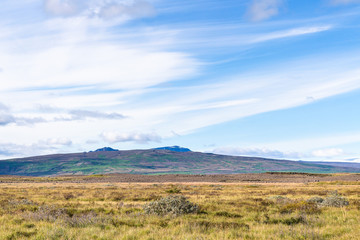 blue sky with white clouds over icelandic meadow