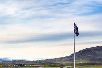 icelandic flag and landscape in Iceland