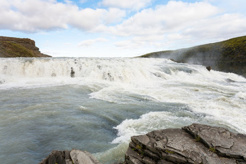 water on rapids of Gullfoss waterfall in canyon