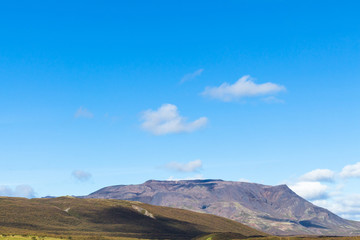 Naklejka na ściany i meble blue sky over mountain in Iceland in september