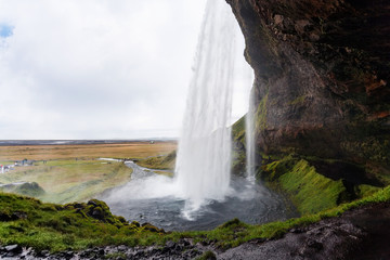 wet path around Seljalandsfoss waterfall