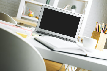 Fototapeta na wymiar Modern workspace with empty laptop screen