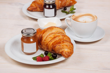 Close up of tasty croissant with home made jam