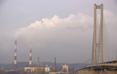 The pipe of the plant emits harmful substances into the atmosphere.