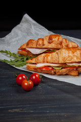 Close up of tasty croissant on the wooden board