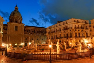 Fototapeta na wymiar Palermo, Sicily, Italy - night view of Fountain of shame on baroque Pretoria square at night