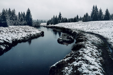 Jizera river in Jizerka, Czech Republic, in the winter, covered by snow