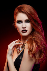 Fototapeta premium beautiful girl with bright makeup and red hair