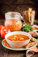 Hot aromatic rich tomato soup with meatballs, vegetables, red lentils, thyme, tasty homemade first course, food