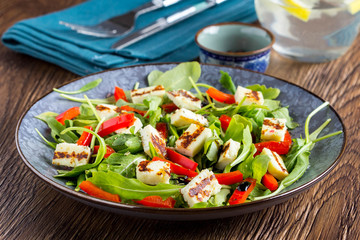 Salad with grilled cheese, spinach, tomatoes, pepper, paprika, tatsy lunch diet dish