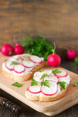 Sandwiches with feta, radish and parsley or dill. Rustic style.