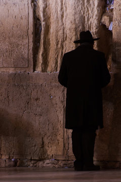 Man praying at the Wailing Wall in Jerusalem, Israel