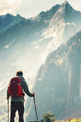Man hiking in mountains Travel Lifestyle concept adventure active summer vacations wayfaring...
