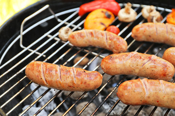 Sausages on barbecue grill