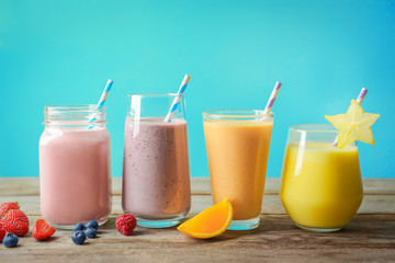 Different milkshakes in glassware on table
