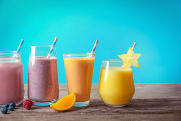 Different milkshakes in glassware on table