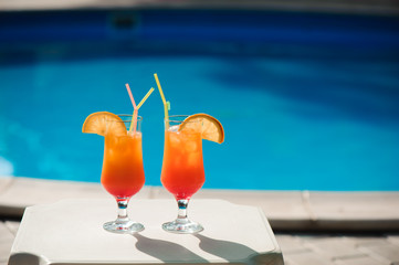 Cocktails on the background of the pool