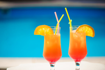 Cocktails on the background of the pool