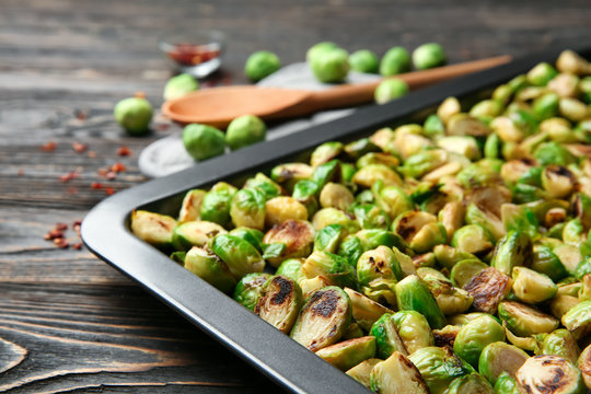 Baking tray with roasted brussel sprouts on table