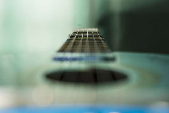 Abstract guitar strings/Shallow depth of field image of an acoustic toy guitar strings.