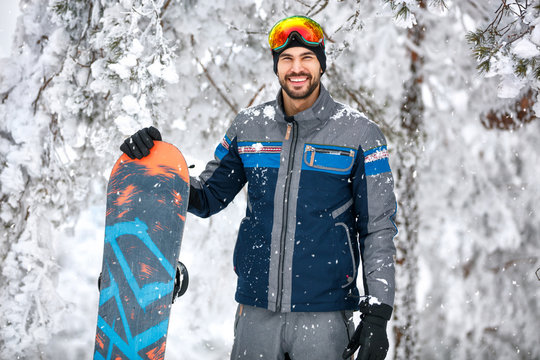 Male snowboarder with ski equipment