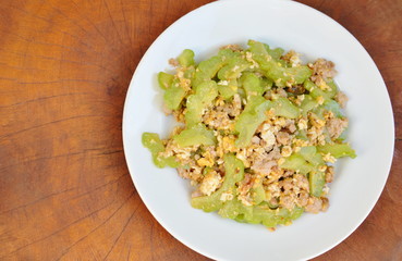 stir fried bitter cucumber with minced pork and egg on plate