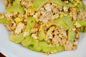 stir fried bitter cucumber with minced pork and egg on plate