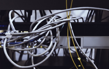 Fiber Optic cables connected to an optic ports and Network cables connected to ethernet ports