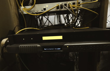Fiber Optic cables connected to an optic ports and Network cables connected to ethernet ports