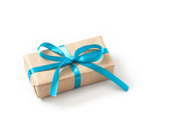 Gift box in wrapping paper tied with colorful blue ribbon 