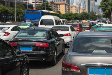 Fototapeta na wymiar traffic jam on main street with row of cars