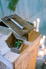 arts and crafts, creating, planting concept. work place of the master with few wooden box, big and small, hammer and lots of blured lights on the background