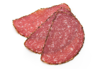 Salami slices isolated on the white background.