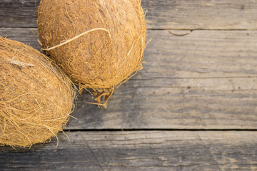 Coconut nuts, ripe on a wooden table