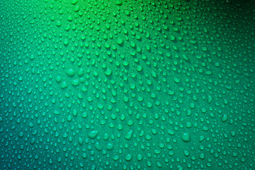Water Drops On Green Background.