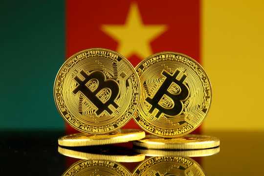 Physical version of Bitcoin and Cameroon Flag. Close up. - Powered by Adobe