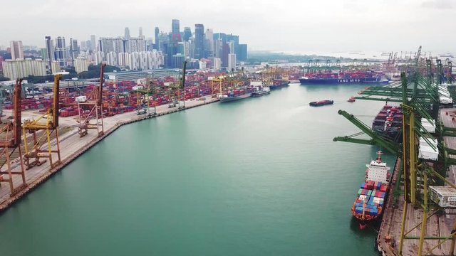 Singapore. November 21, 2017: Pan left to right of drone view of Singapore container yard with crane and container. Shot in 4k resolution